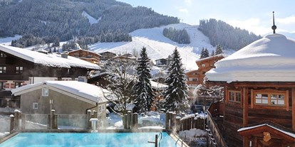 Hochzeit - Umgebung: am Land - Kitzbühel - Außenpool und Sauna - The Alpine Palace